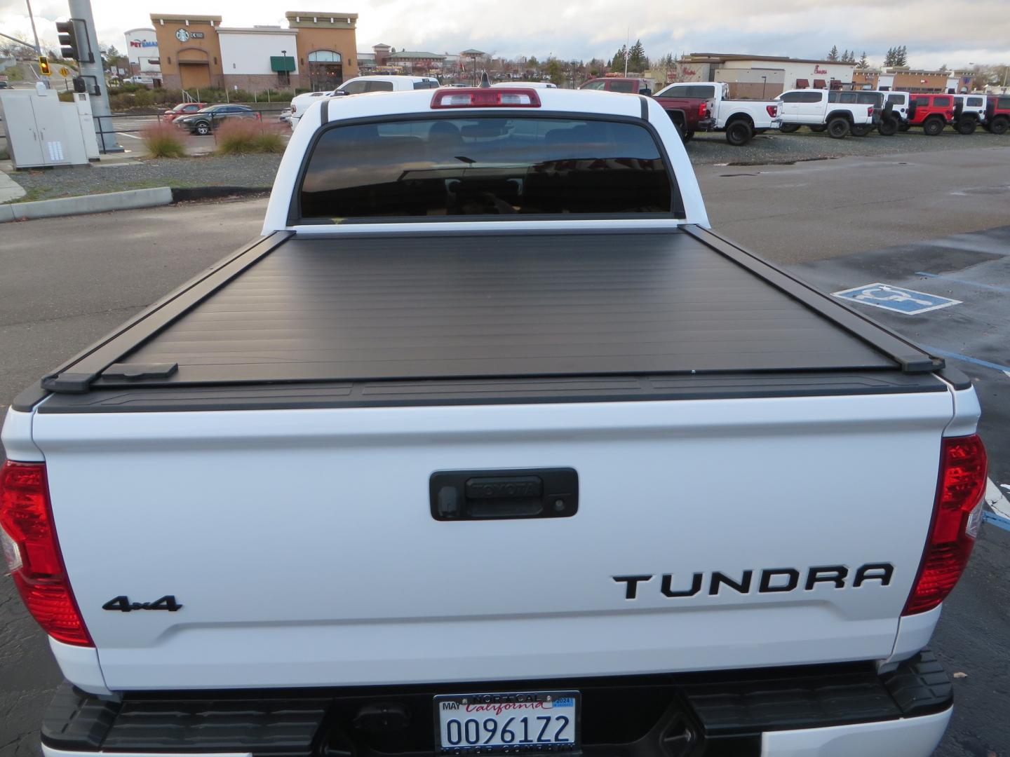 2020 White /BLACK Toyota Tundra SR5 5.7L V8 CrewMax 4WD (5TFDY5F12LX) with an 5.7L V8 DOHC 32V engine, 6A transmission, located at 2630 Grass Valley Highway, Auburn, CA, 95603, (530) 508-5100, 38.937893, -121.095482 - Clean tundra featuring a level kit, Icon Vehicle Dynamicxs upper control arms, 18" Method NV wheels, 35" BFG KO2 tires, Rocksliders, Retrax bedcover, Rigid Industries fog lights, RoadActive Suspension Custom Leaf Spring Enhancement Kit. - Photo#12